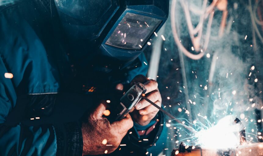 man using welding machine